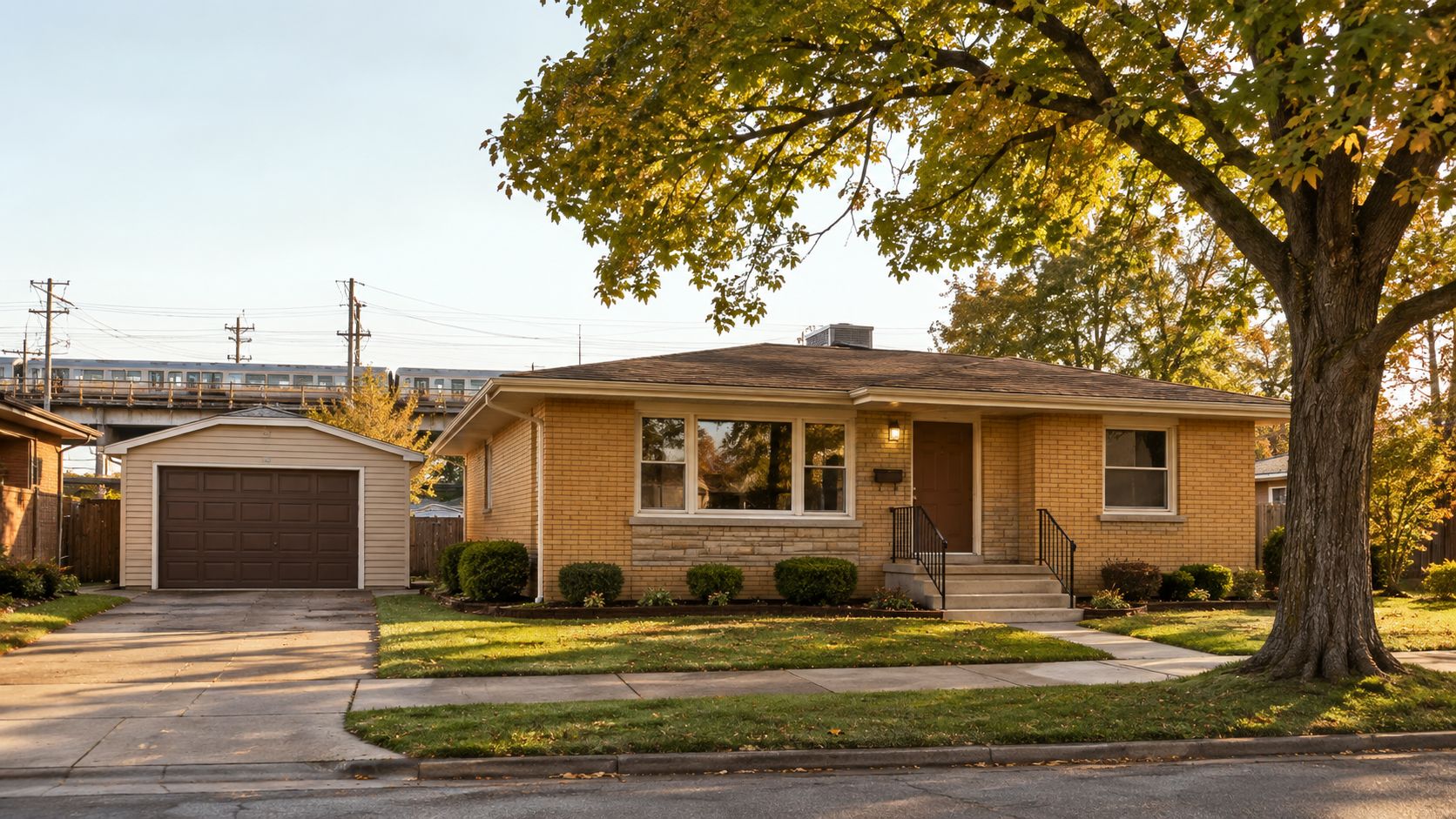 A charming single-story brick house with a brown garage and a large tree in the front yard.